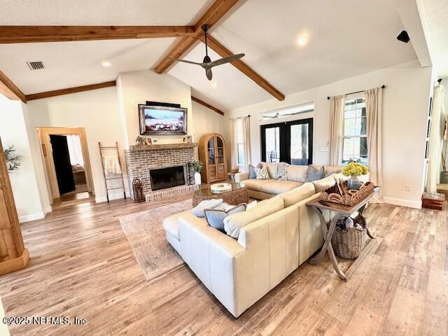34424 Mitigation Trail Callahan, FL 32011 - Photo 7 of 44 a living room with furniture a fireplace and a flat screen tv