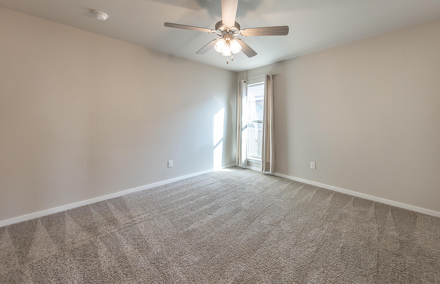 7526 31st Place Lubbock, TX 79407 - Photo 16 of 22 a view of an empty room with a window
