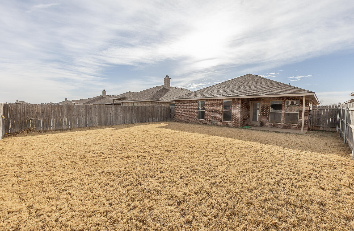 7526 31st Place Lubbock, TX 79407 - Photo 19 of 22 a view of a house with a yard