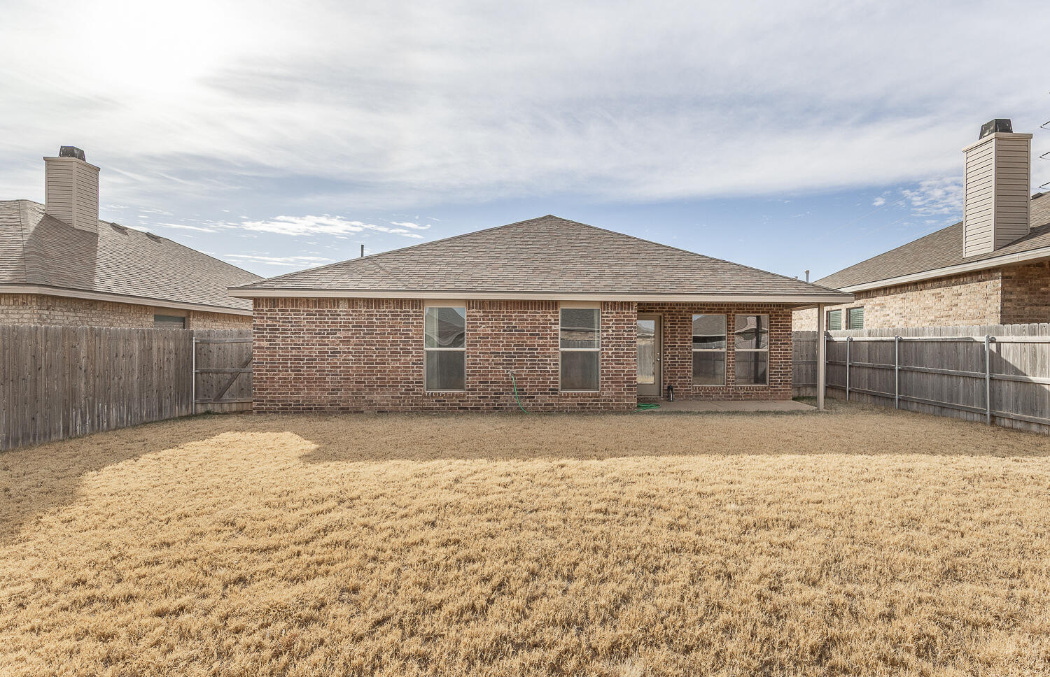 7526 31st Place Lubbock, TX 79407 - Photo 20 of 22 a view of a backyard of the house
