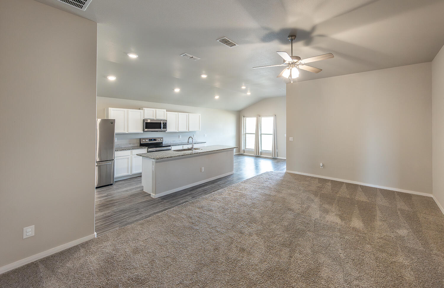 7526 31st Place Lubbock, TX 79407 - Photo 2 of 22 a large kitchen with cabinets and stainless steel appliances