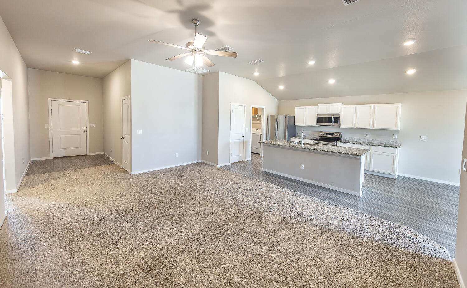 7526 31st Place Lubbock, TX 79407 - Photo 5 of 22 a view of kitchen with kitchen island and stainless steel appliances