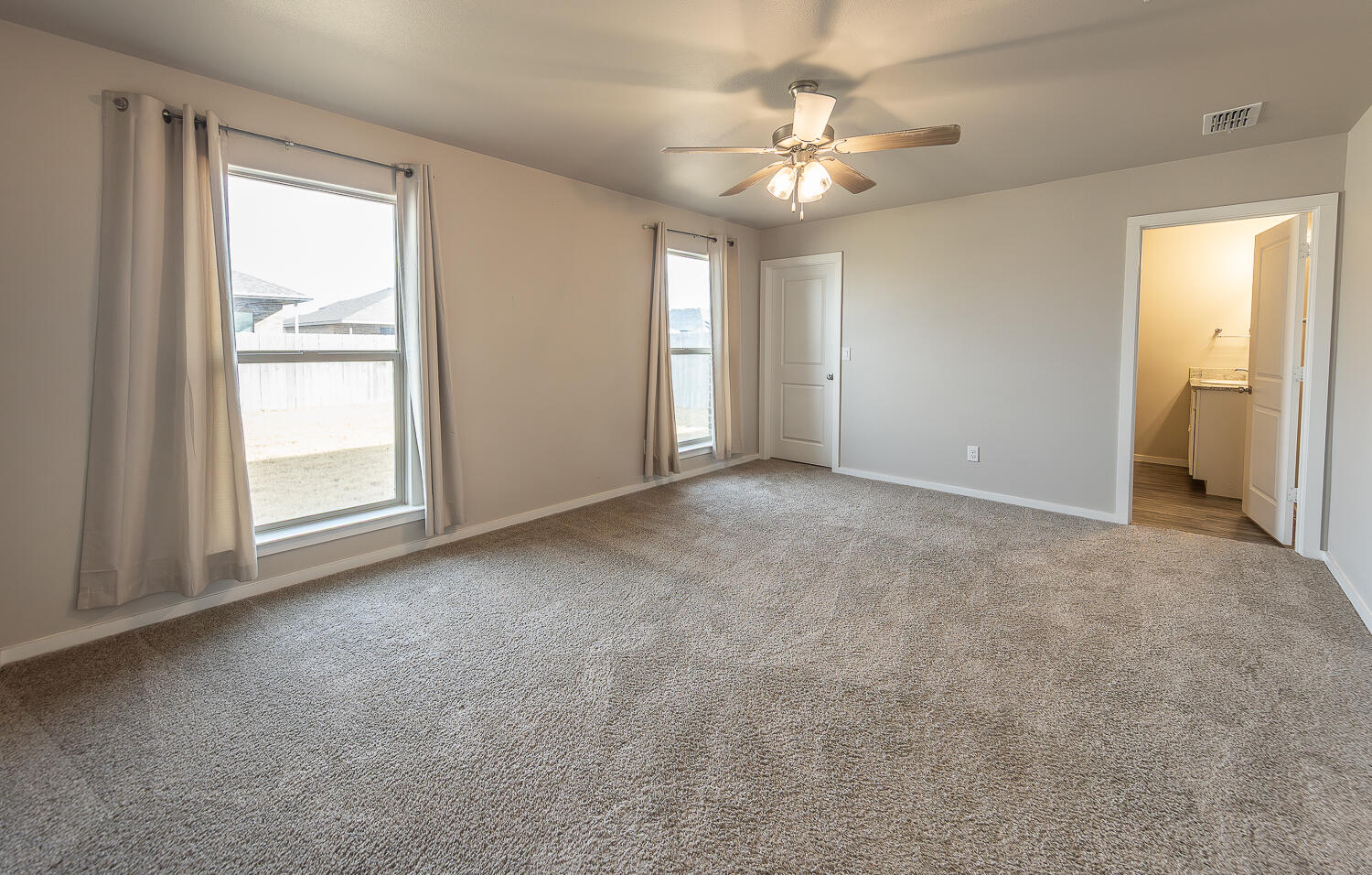 7526 31st Place Lubbock, TX 79407 - Photo 9 of 22 a view of an empty room with a window