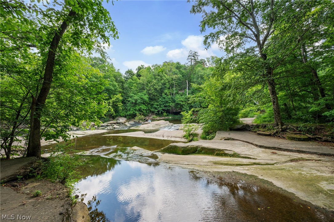 7750 Lewis Road Olmsted Falls, OH 44138 - Photo 46 of 50 Near home Natural water features with exposed rock formations and lush, mature trees