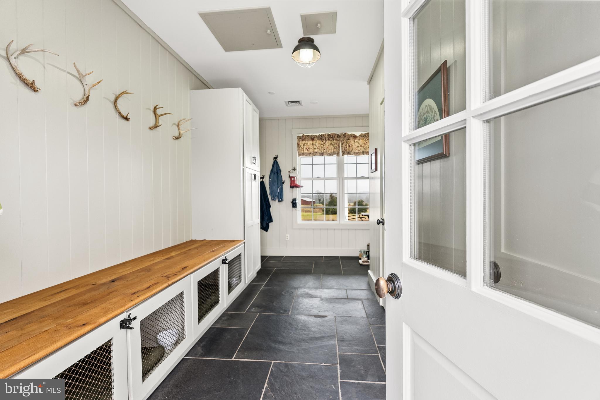 21100 West Offutt Road Poolesville, MD 20837 - Photo 11 of 58 Mudroom entrance w/custom cabinetry, slate floor
