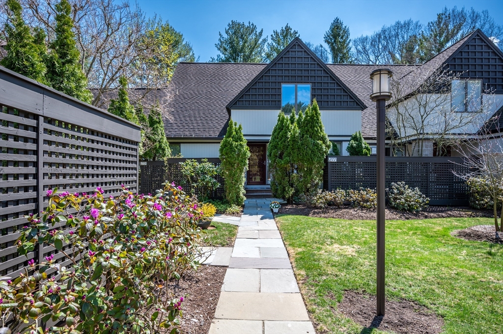 277 Nahanton Street, Unit 277 Newton, MA 02459 - Photo 1 of 39 a view of a house with a yard and garden