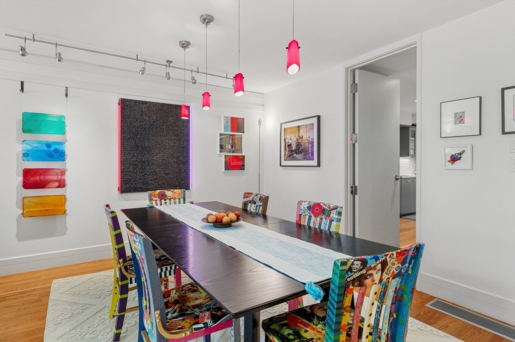 277 Nahanton Street, Unit 277 Newton, MA 02459 - Photo 11 of 39 a view of a dining room with furniture and wooden floor