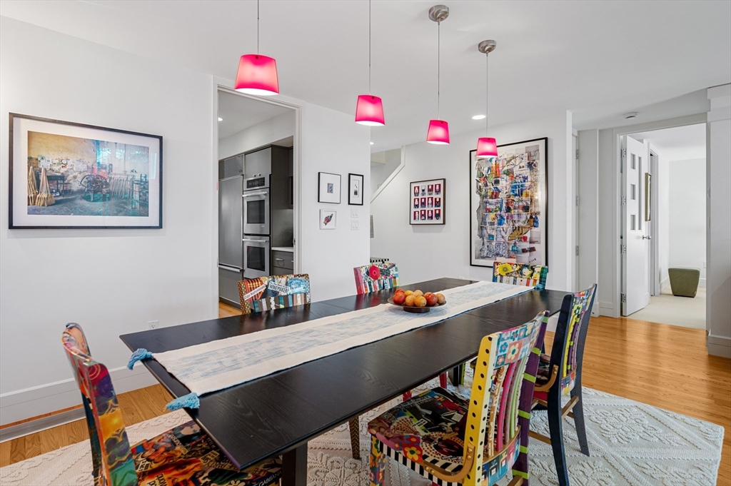 277 Nahanton Street, Unit 277 Newton, MA 02459 - Photo 12 of 39 a view of a dining room with furniture and wooden floor