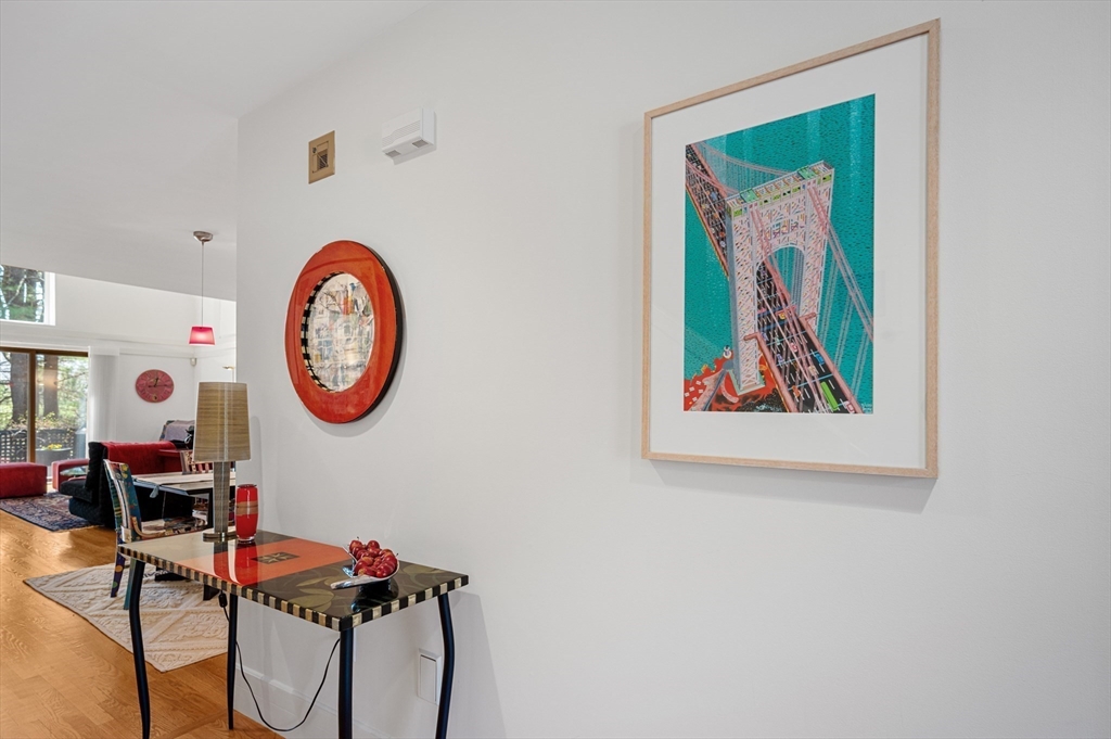 277 Nahanton Street, Unit 277 Newton, MA 02459 - Photo 13 of 39 a view of a dinning room with furniture and a wall painting