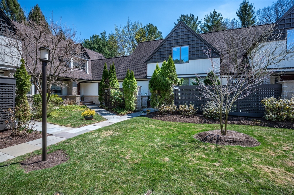 277 Nahanton Street, Unit 277 Newton, MA 02459 - Photo 2 of 39 a house that has a tree in front of the house