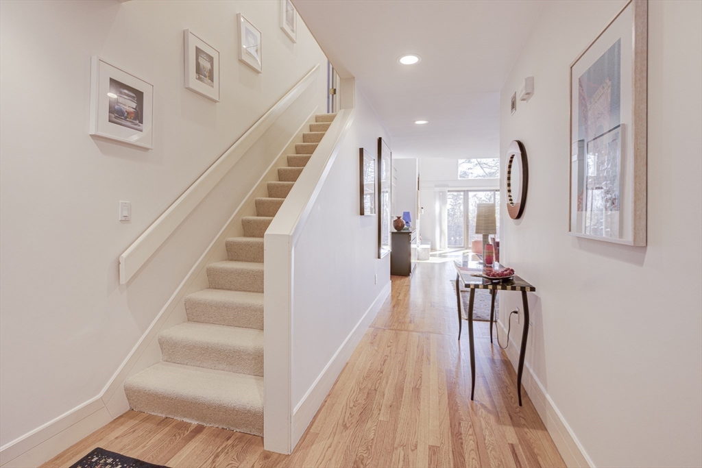 277 Nahanton Street, Unit 277 Newton, MA 02459 - Photo 22 of 39 a view of entryway and hall with wooden floor