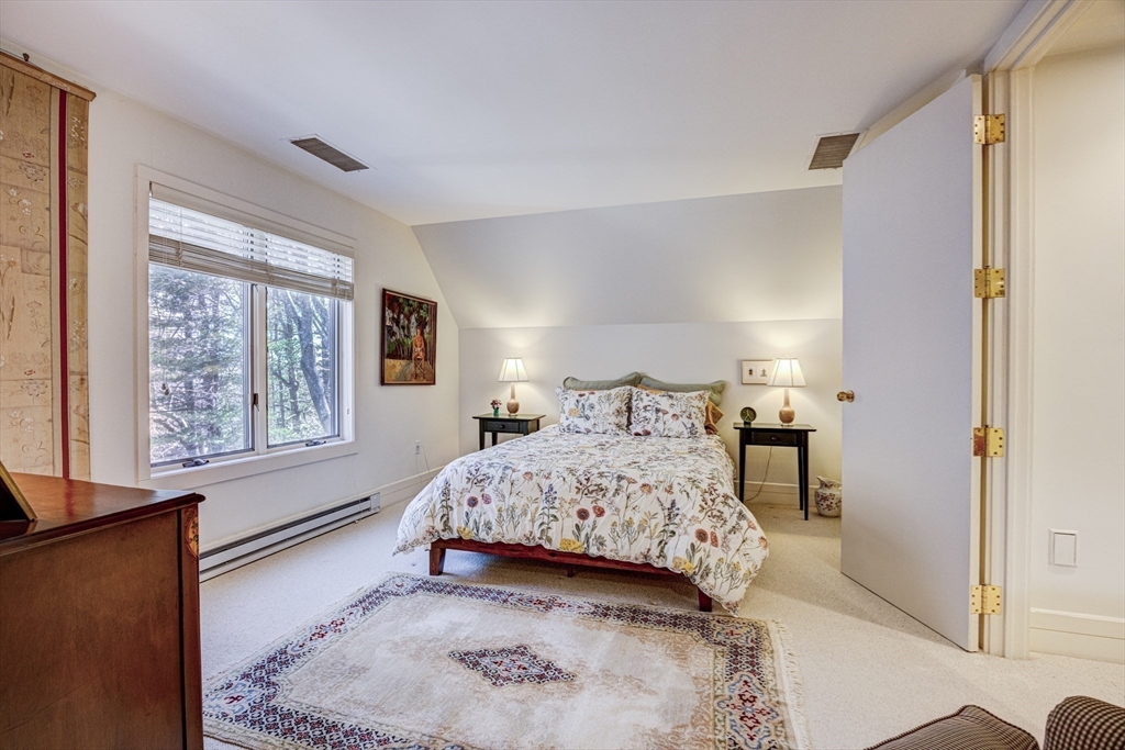 277 Nahanton Street, Unit 277 Newton, MA 02459 - Photo 25 of 39 a bedroom with a large bed and a window
