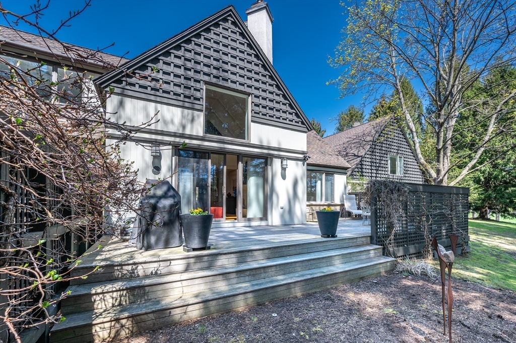 277 Nahanton Street, Unit 277 Newton, MA 02459 - Photo 28 of 39 a view of a house with a iron gate
