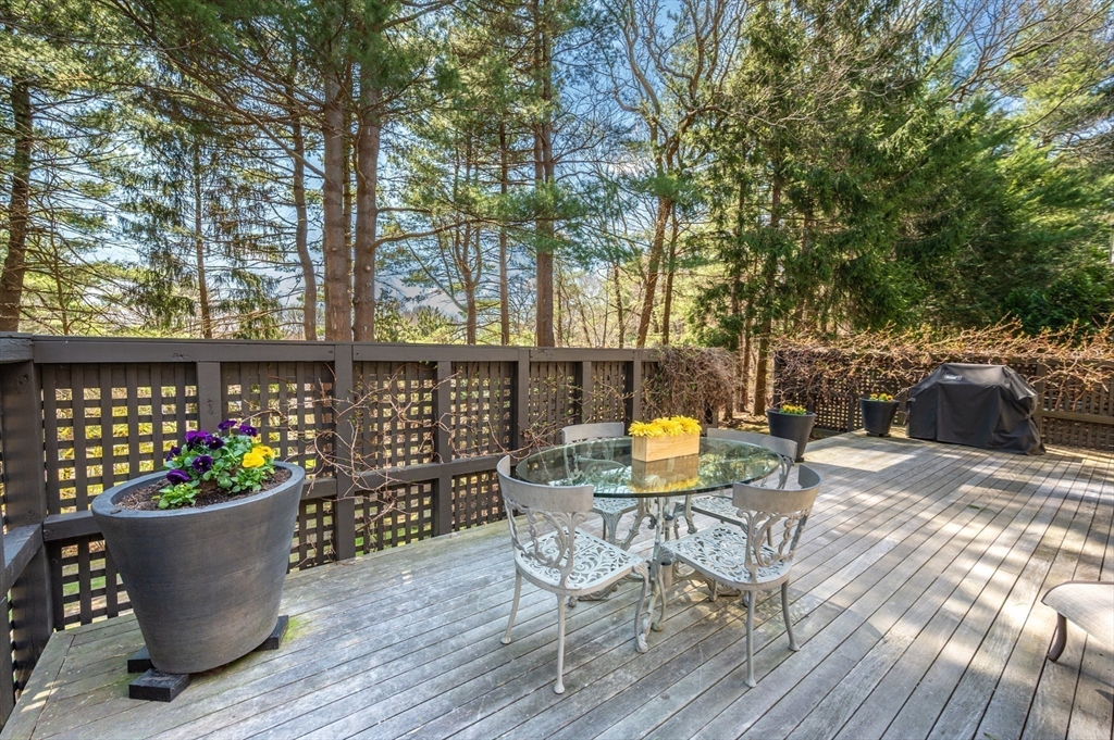 277 Nahanton Street, Unit 277 Newton, MA 02459 - Photo 29 of 39 a view of a chairs and table in the patio