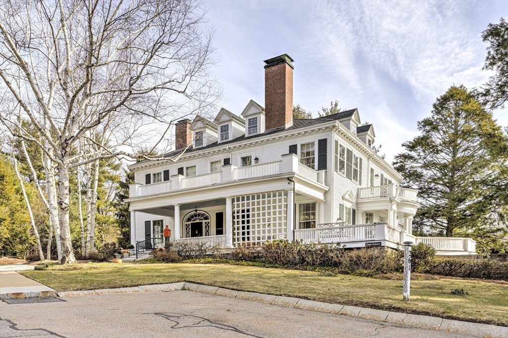 277 Nahanton Street, Unit 277 Newton, MA 02459 - Photo 33 of 39 a front view of a house with a garden