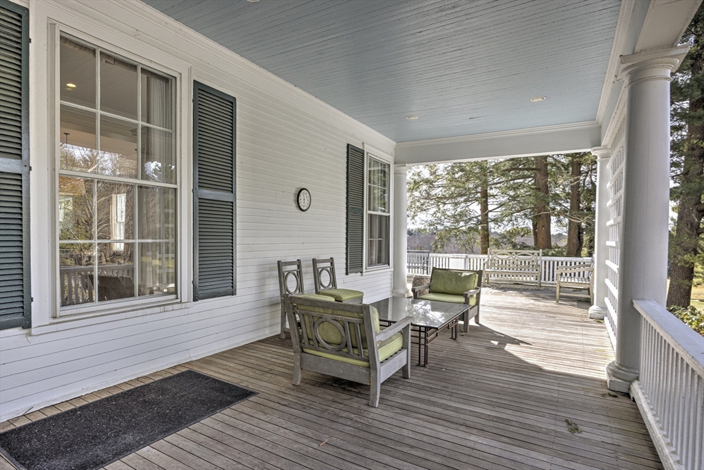 277 Nahanton Street, Unit 277 Newton, MA 02459 - Photo 35 of 39 a living room with large windows and wooden floor