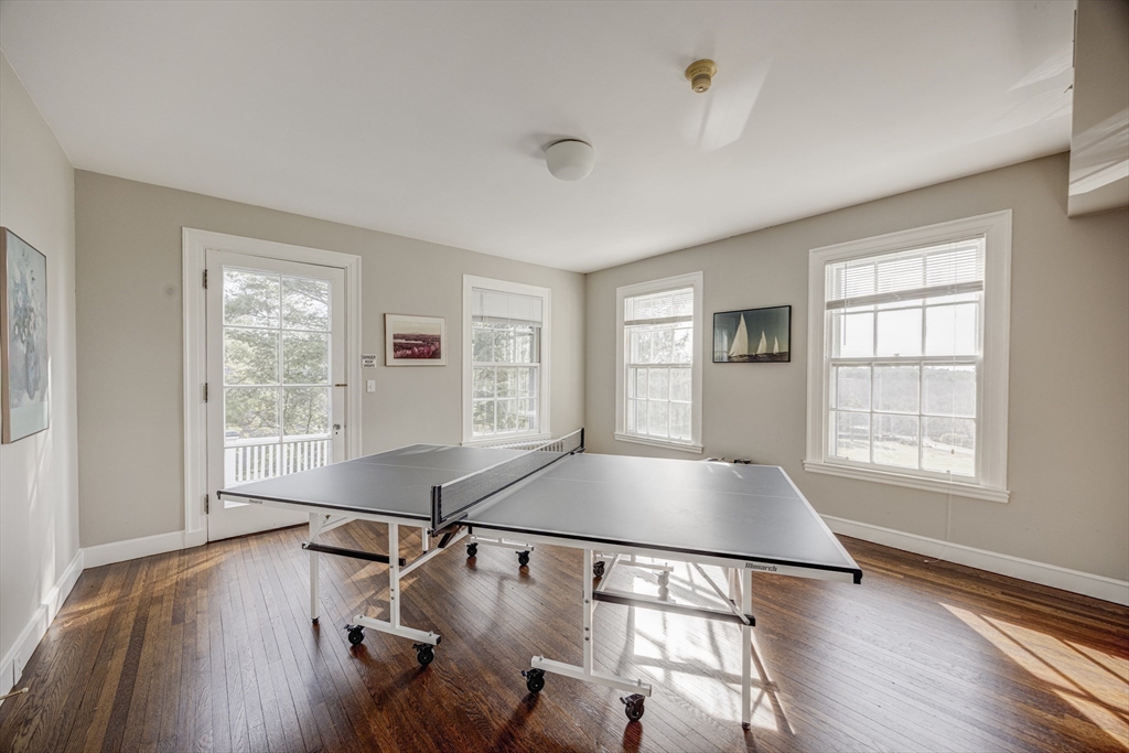 277 Nahanton Street, Unit 277 Newton, MA 02459 - Photo 38 of 39 a living room with dining room and wooden floor