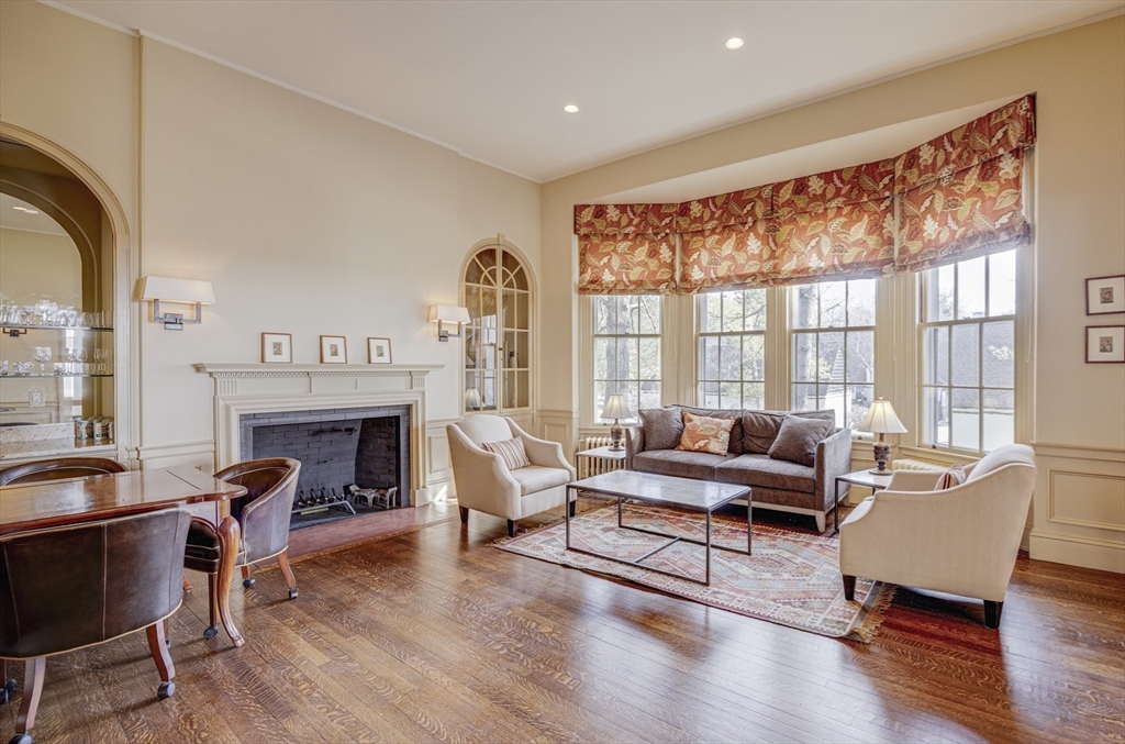 277 Nahanton Street, Unit 277 Newton, MA 02459 - Photo 39 of 39 a living room with furniture and a fireplace
