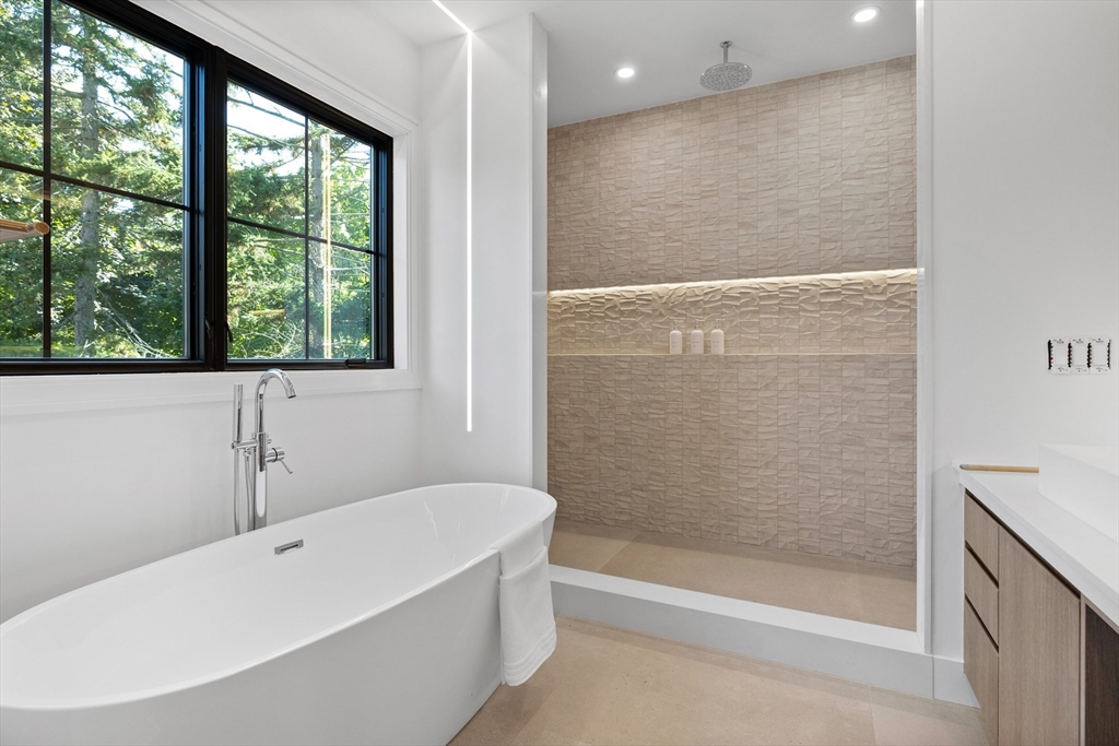 34 Garrison Road Wellesley, MA 02482 - Photo 15 of 28 a bathroom with a bathtub and shower