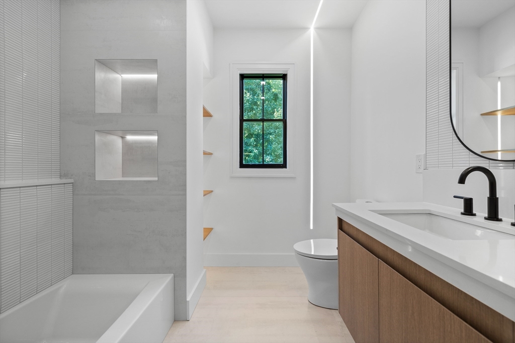 34 Garrison Road Wellesley, MA 02482 - Photo 17 of 28 a bathroom with a sink a toilet and a bathtub