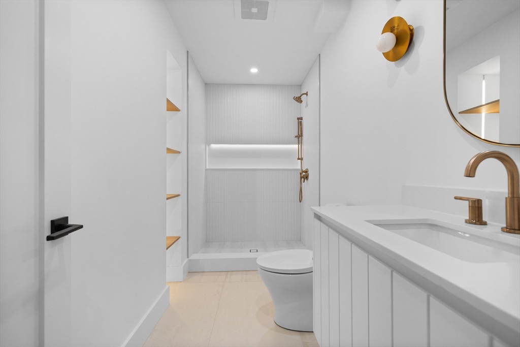 34 Garrison Road Wellesley, MA 02482 - Photo 20 of 28 a bathroom with a sink a toilet and shower