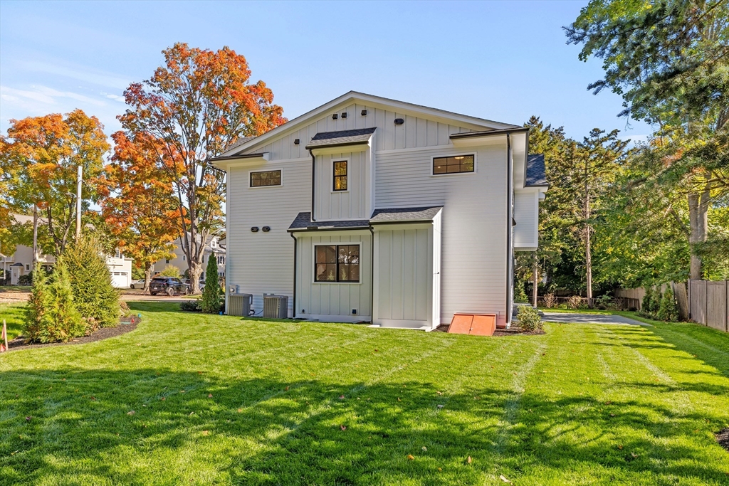 34 Garrison Road Wellesley, MA 02482 - Photo 27 of 28 a front view of a house with a yard