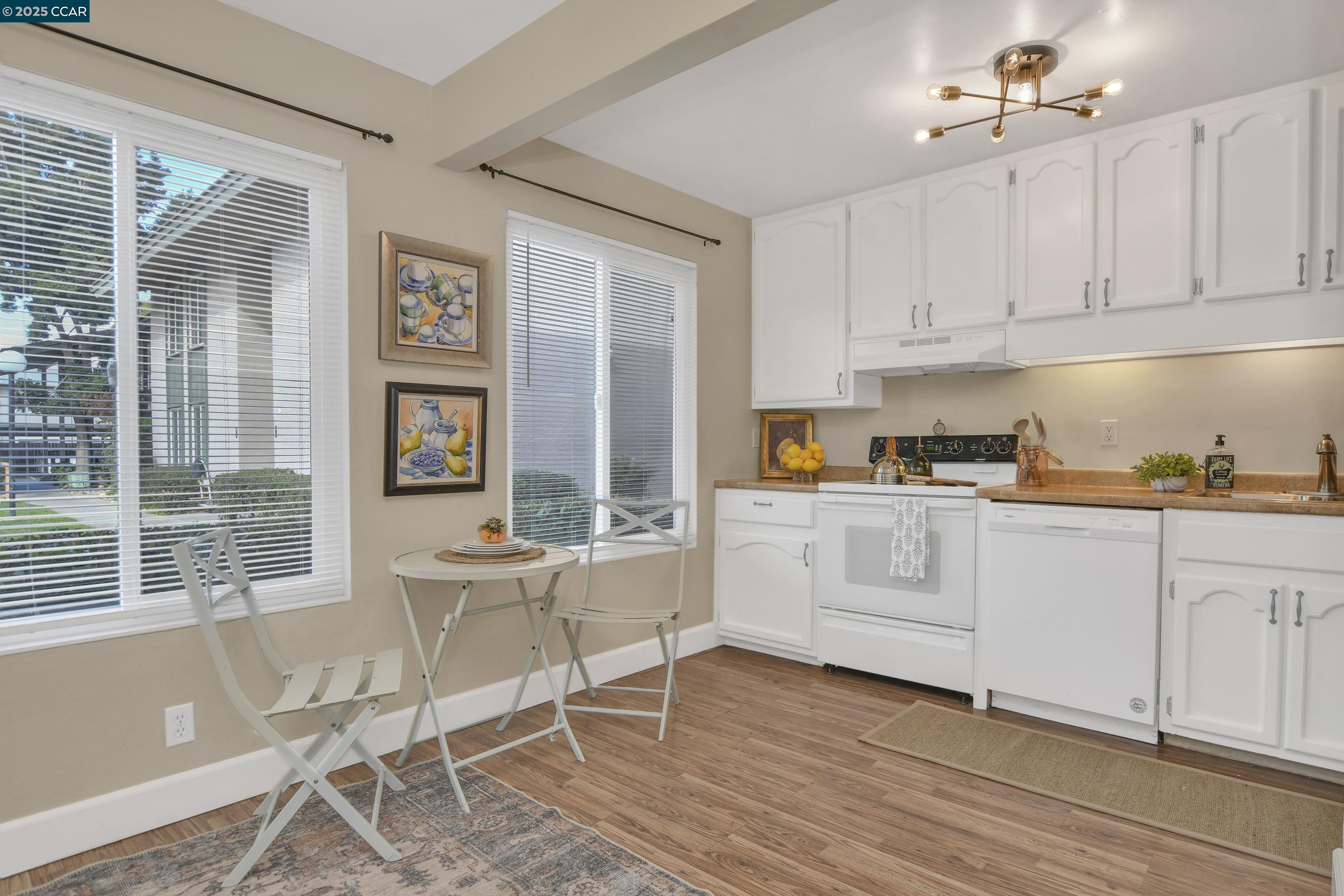 4888 Clayton Road, Unit 6 Concord, CA 94521 - Photo 7 of 16 a view of kitchen with cabinets and wooden floor