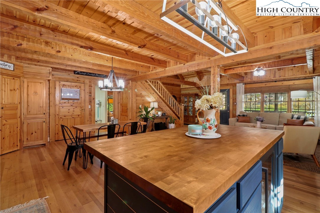 431 Silas Creek Road Lansing, NC 28643 - Photo 9 of 46 a view of a dining room with furniture and wooden floor