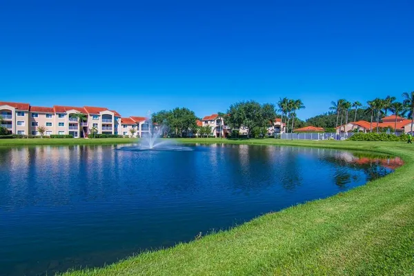 a view of a lake with houses in the back