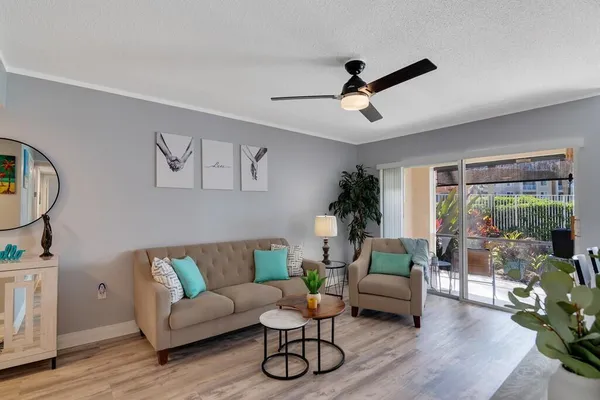 a living room with furniture and a large window