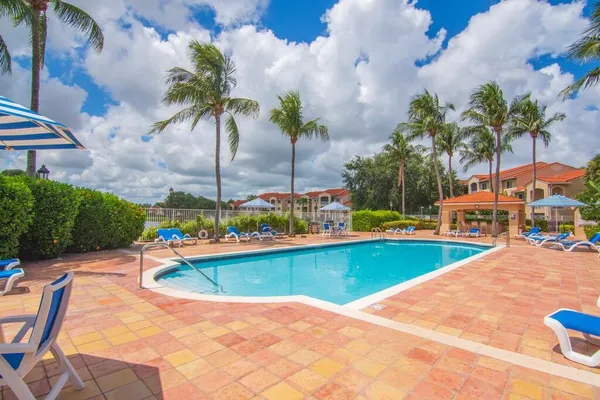 a view of swimming pool with outdoor seating