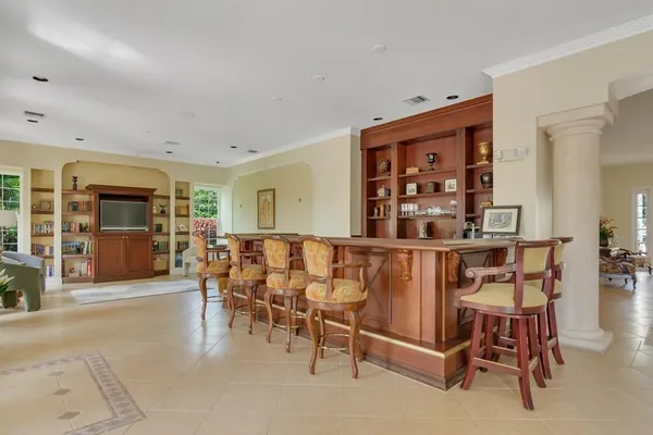 a dining room with furniture and wooden floor