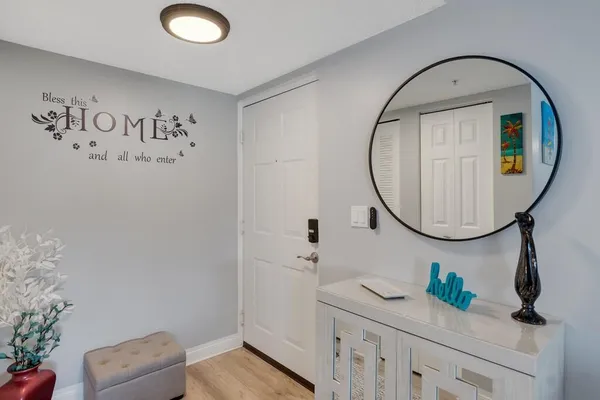a bathroom with a sink a mirror and a shower