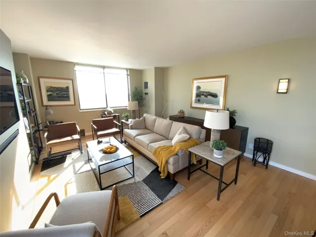 a living room with furniture and a window