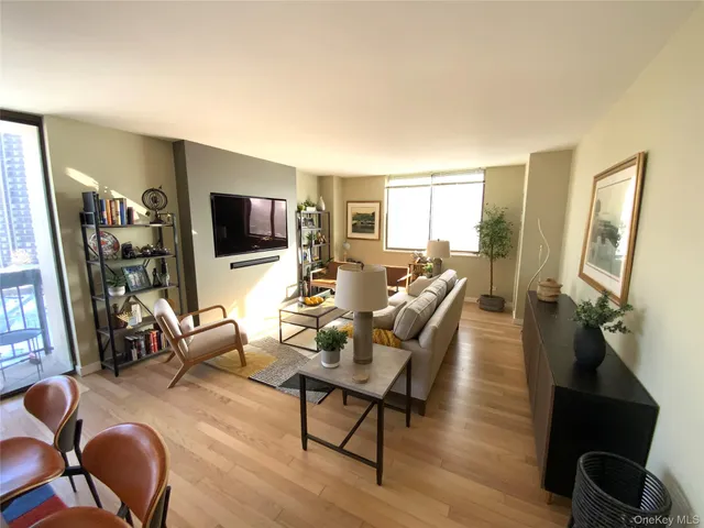 a living room with fireplace furniture and a flat screen tv