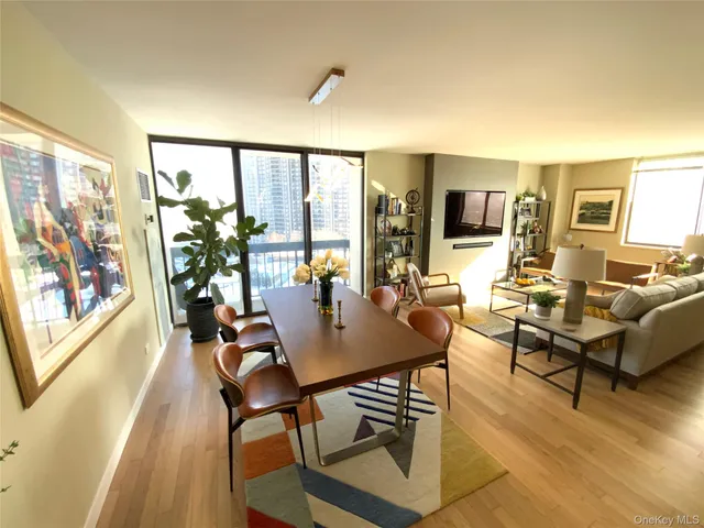a view of a livingroom with furniture and a floor to ceiling window