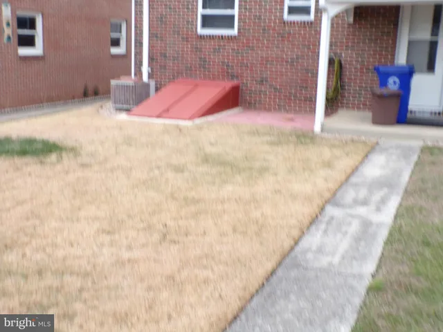 a backyard of a house with seating space