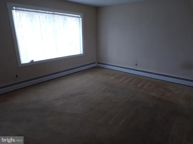 a view of a window in an empty room