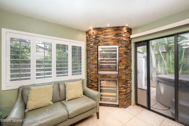 a living room with furniture and windows
