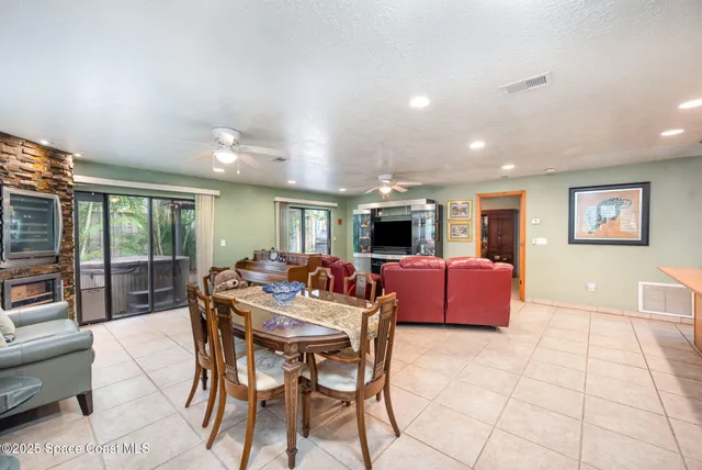 a view of a dining room with furniture window and outside view