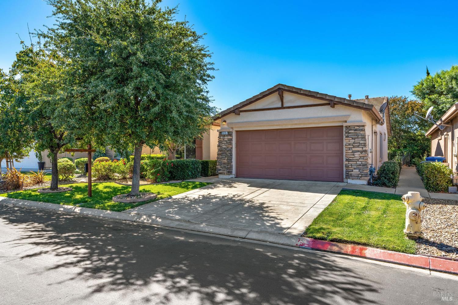 375 Atlantic Drive Rio Vista, CA 94571 - Photo 1 of 1 a front view of a house with a yard and garage