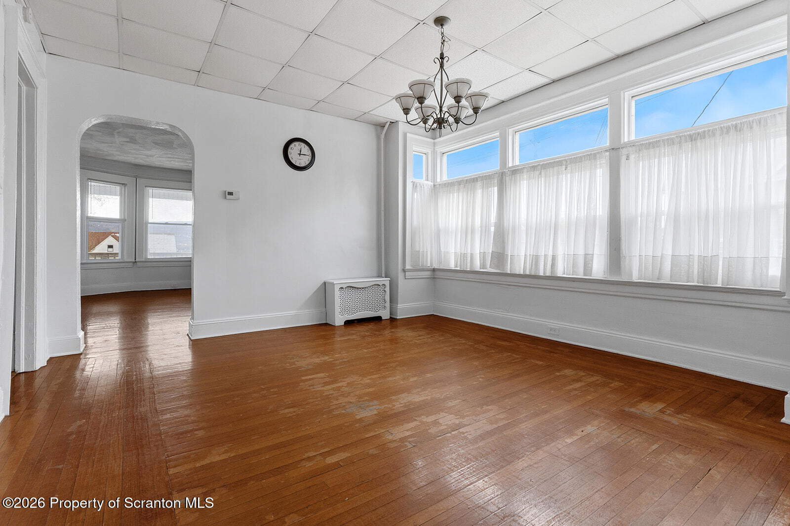846 Monroe Avenue Scranton, PA 18510 - Photo 11 of 87 a view of an empty room with window and wooden floor