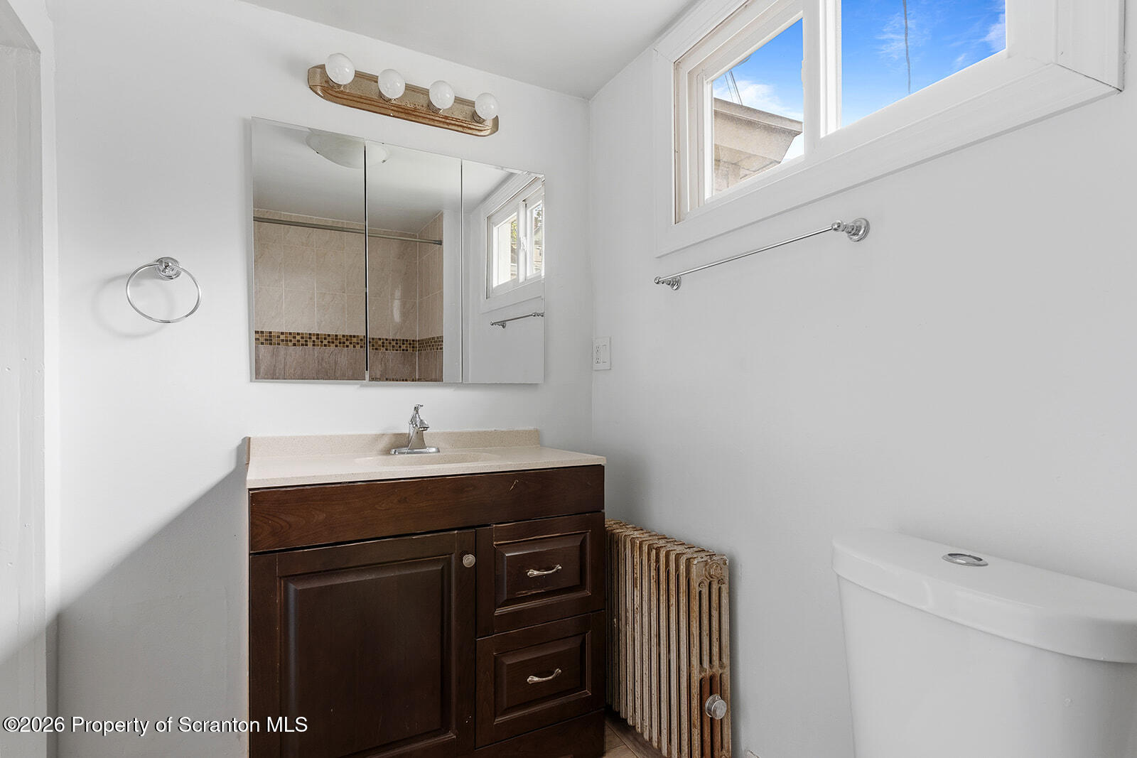 846 Monroe Avenue Scranton, PA 18510 - Photo 23 of 87 a bathroom with a granite countertop sink and a toilet