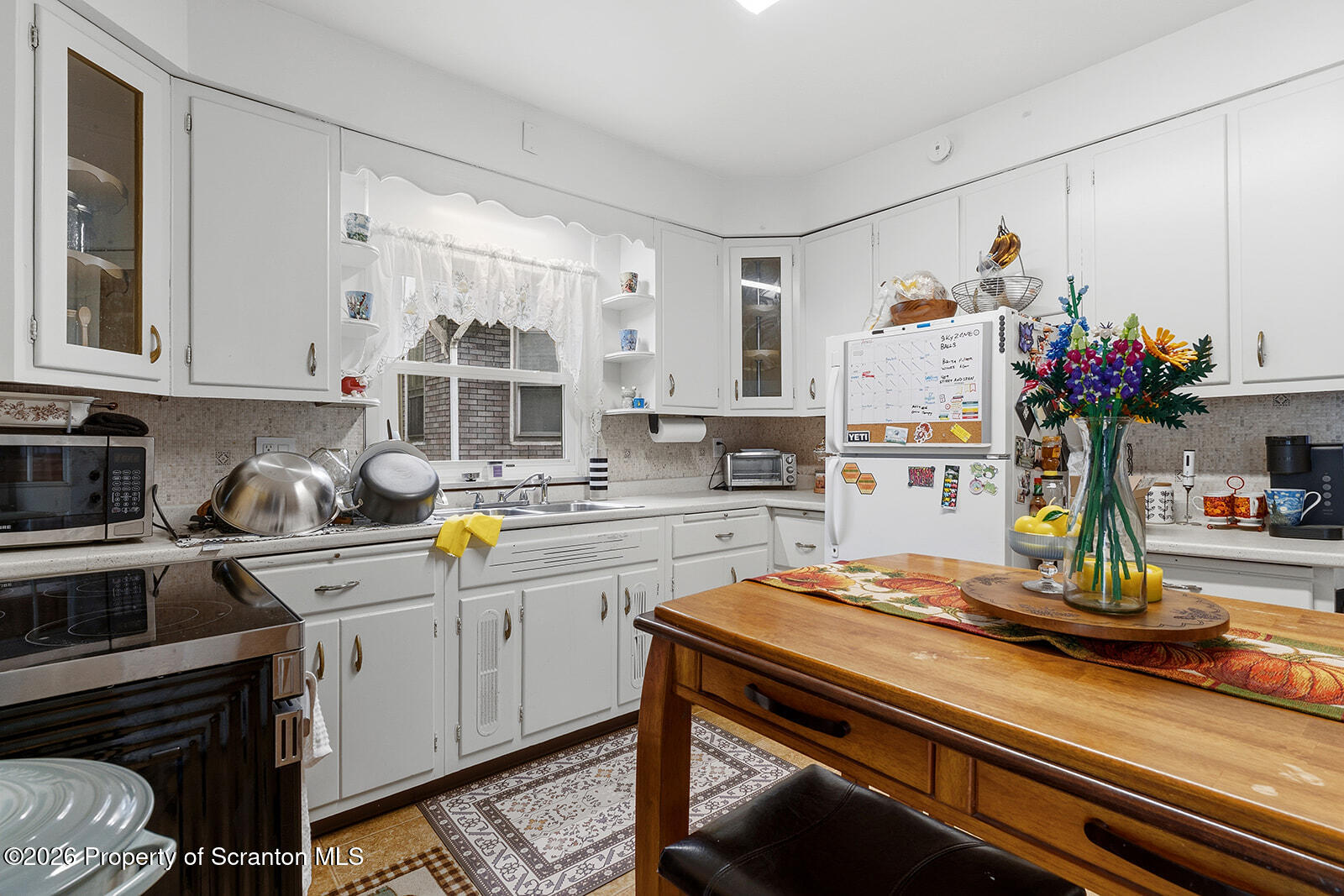 846 Monroe Avenue Scranton, PA 18510 - Photo 28 of 87 a kitchen with kitchen island granite countertop a sink cabinets and stainless steel appliances