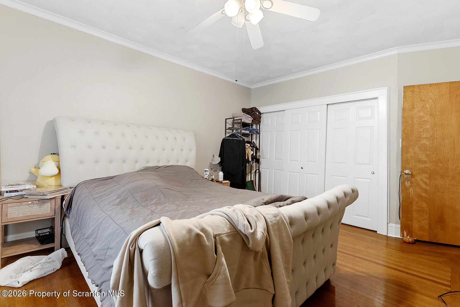 846 Monroe Avenue Scranton, PA 18510 - Photo 38 of 87 a bedroom with a bed and wooden floor