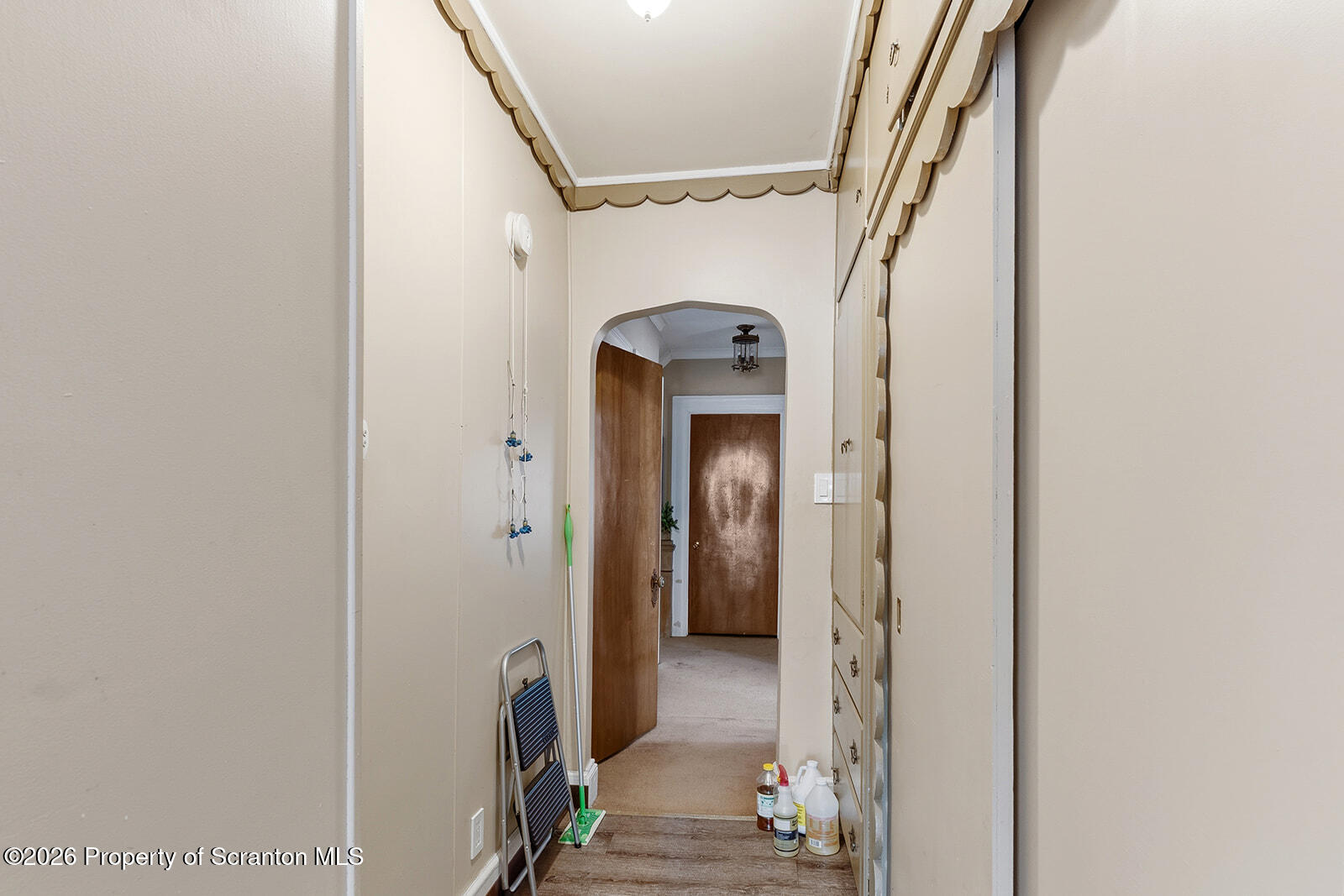 846 Monroe Avenue Scranton, PA 18510 - Photo 42 of 87 a view of a hallway with wooden floor and staircase