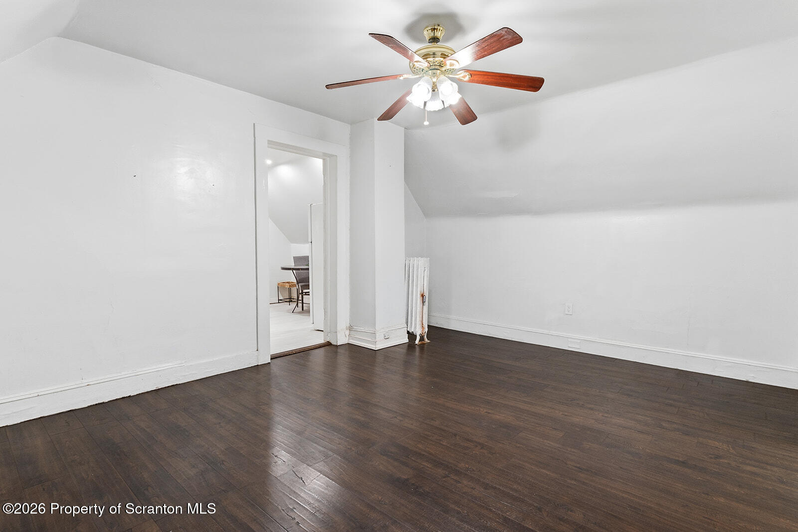 846 Monroe Avenue Scranton, PA 18510 - Photo 52 of 87 an empty room with wooden floor and a ceiling fan
