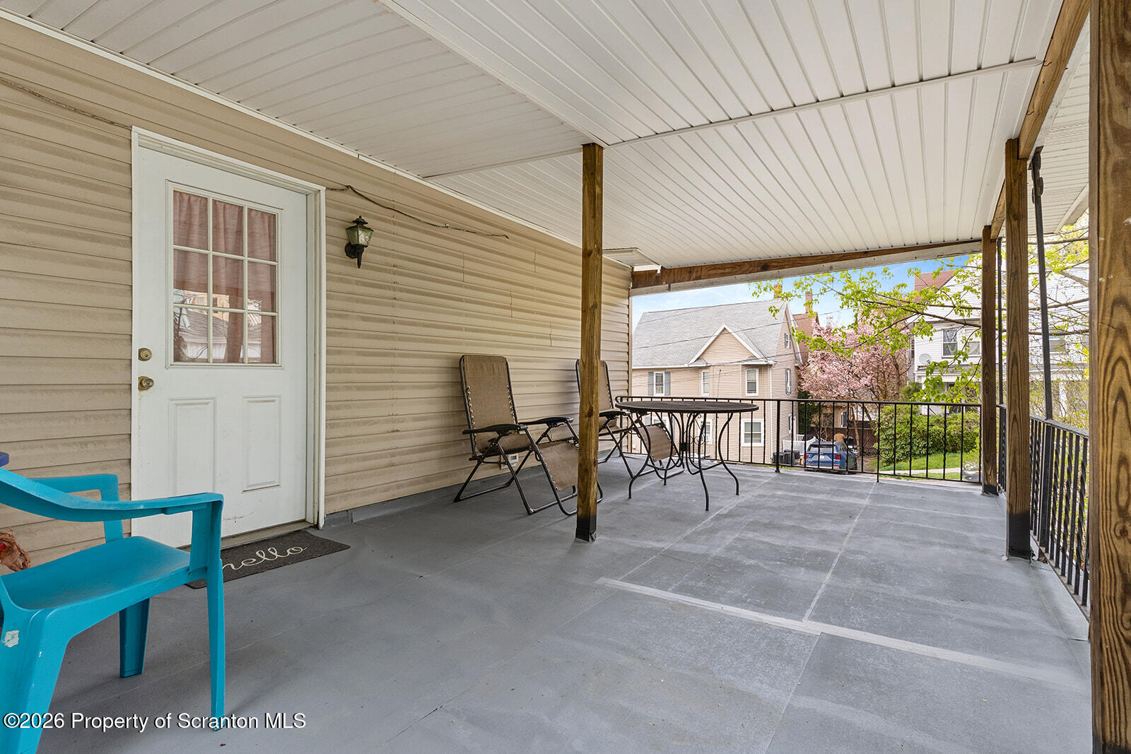 846 Monroe Avenue Scranton, PA 18510 - Photo 66 of 87 a view of a porch with chairs and backyard of the house