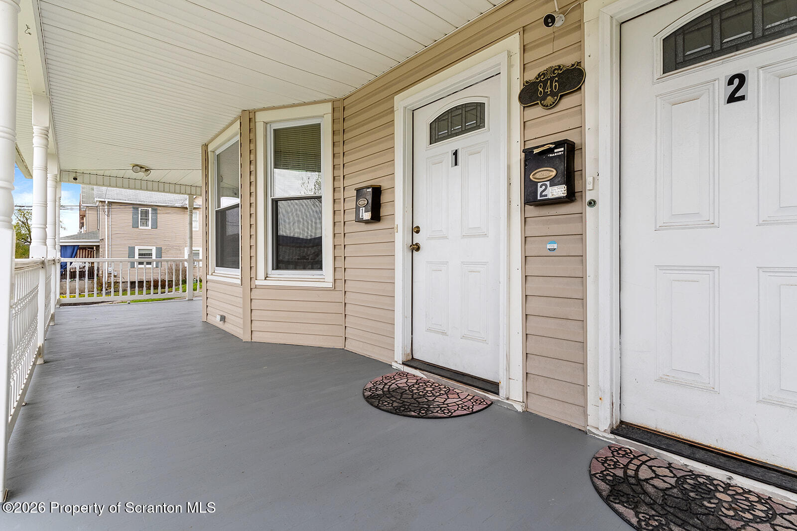 846 Monroe Avenue Scranton, PA 18510 - Photo 73 of 87 a view of a livingroom with entryway wooden floor and windows
