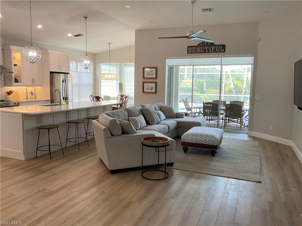 1709 Marsh Run Naples, FL 34109 - Photo 11 of 19 a living room with furniture and a large window